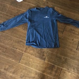 A bundle of a sweater and log sleeves shirt